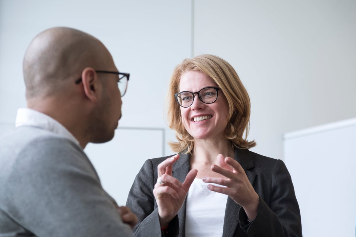 Two advisors working through a financial question together
